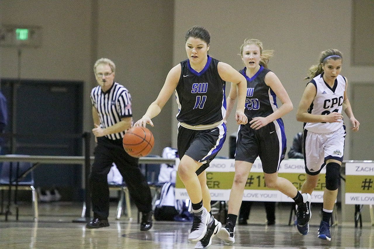 John William Howard/Bothell-Kenmore Reporter — South Whidbey’s Megan Drake leads a second-half fast break during the Falcons’ win on Friday evening in Bothell. Drake scored 12 points in the victory.