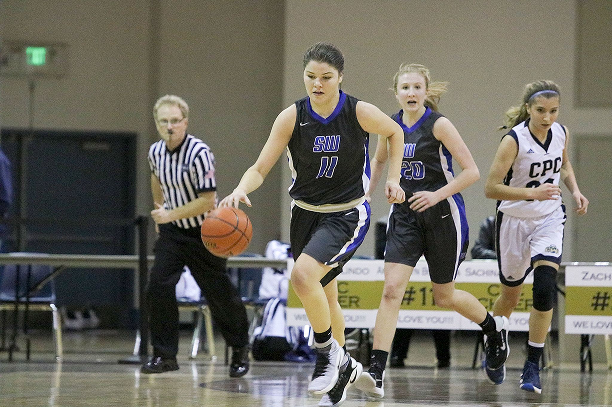 John William Howard/Bothell-Kenmore Reporter                                South Whidbey’s Megan Drake leads a second-half fast break during the Falcons’ win on Friday evening in Bothell. Drake scored 12 points in the victory.