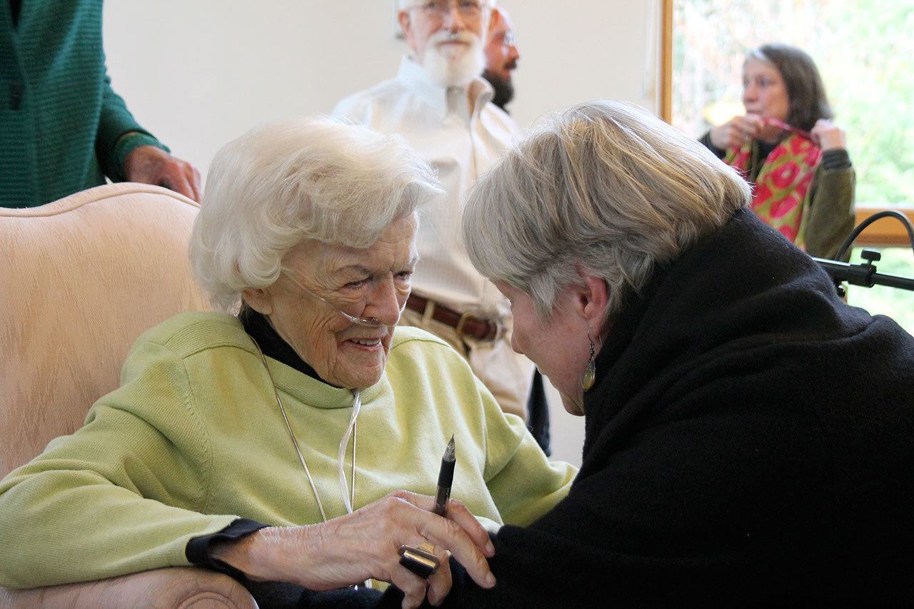 Kyle Jensen / The Record — Wells gives a final embrace with a friend after her discussion at Unitarian Universalist Congregation Tuesday afternoon.