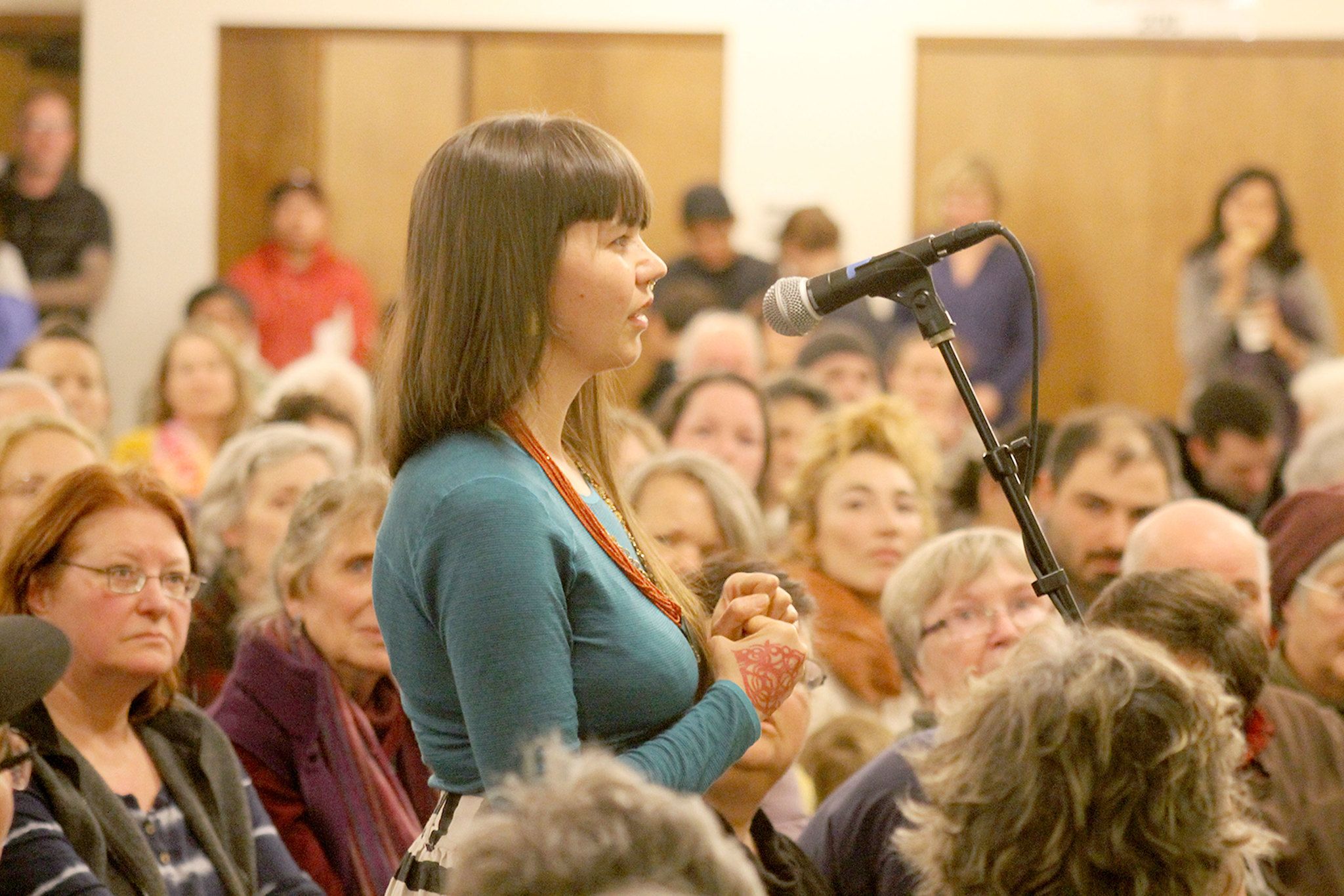 Evan Thompson / The Record                                Sumer Eberhart, a Langley resident, speaks to panelists at Thursday night’s educational community meeting on Langley becoming a sanctuary city.