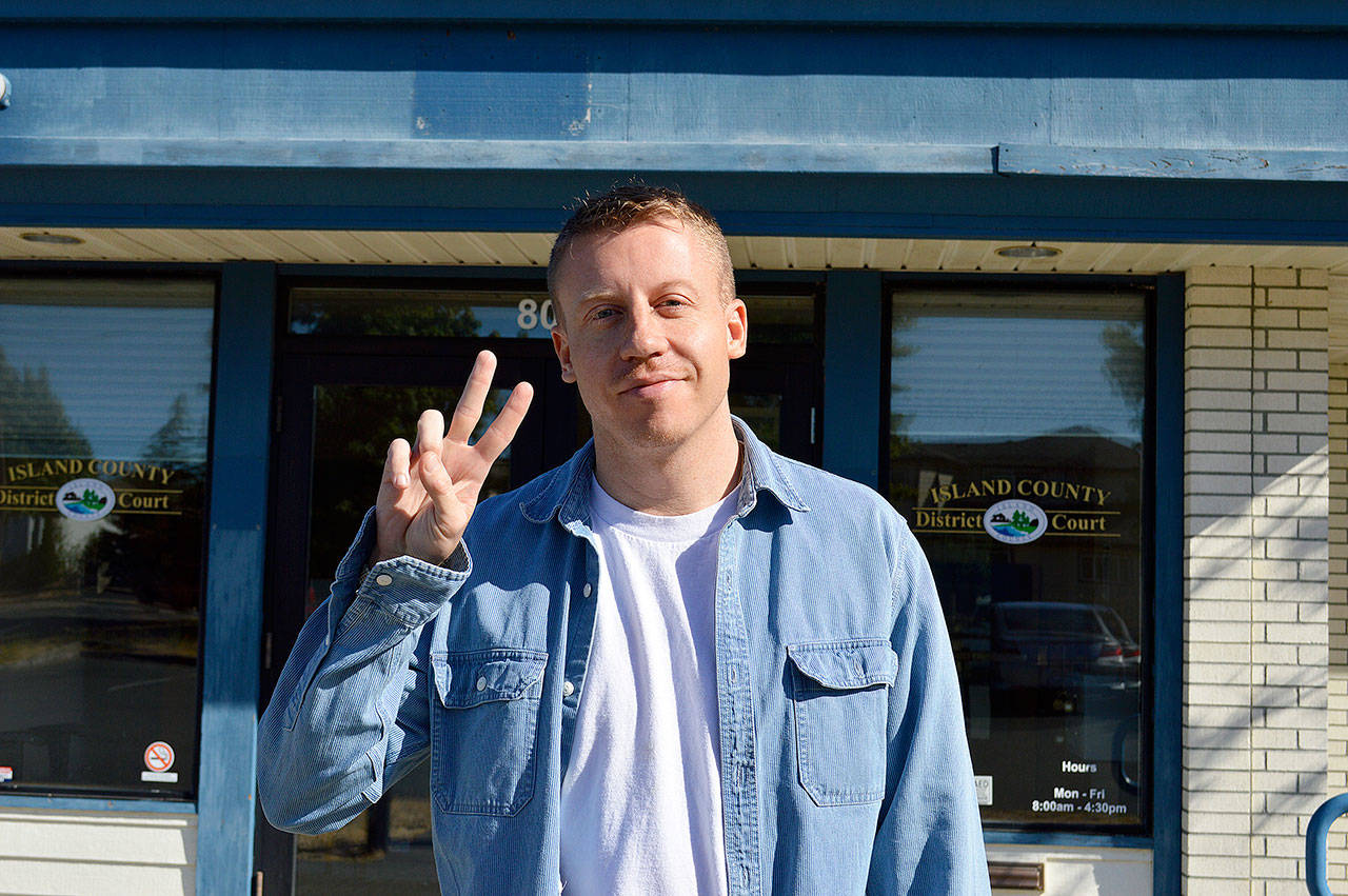 Jessie Stensland / Whidbey News Group — Macklemore dives the peace sign outside Island County District Court in Oak Harbor.