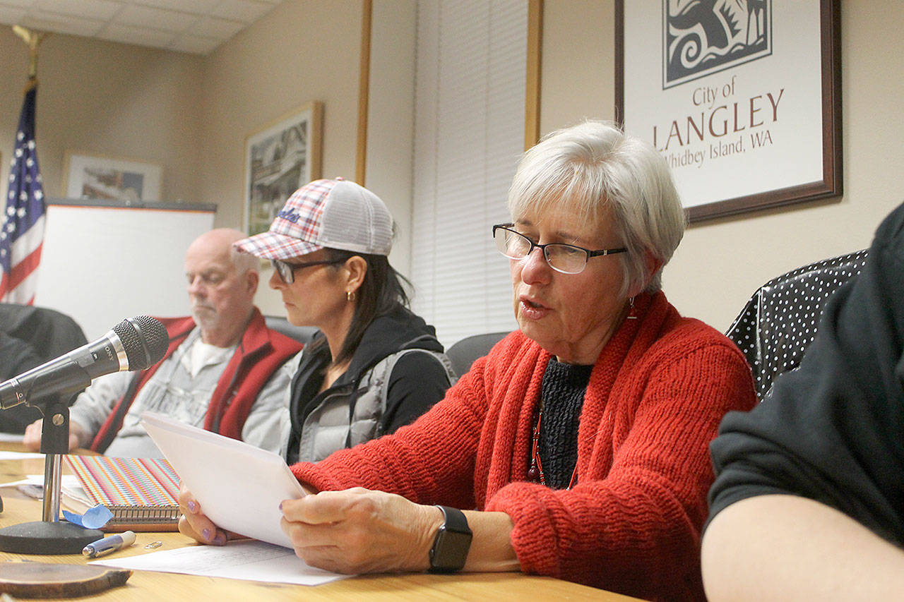 Record file — City Councilwoman Dominique Emerson reads from a city document at a past council meeting.