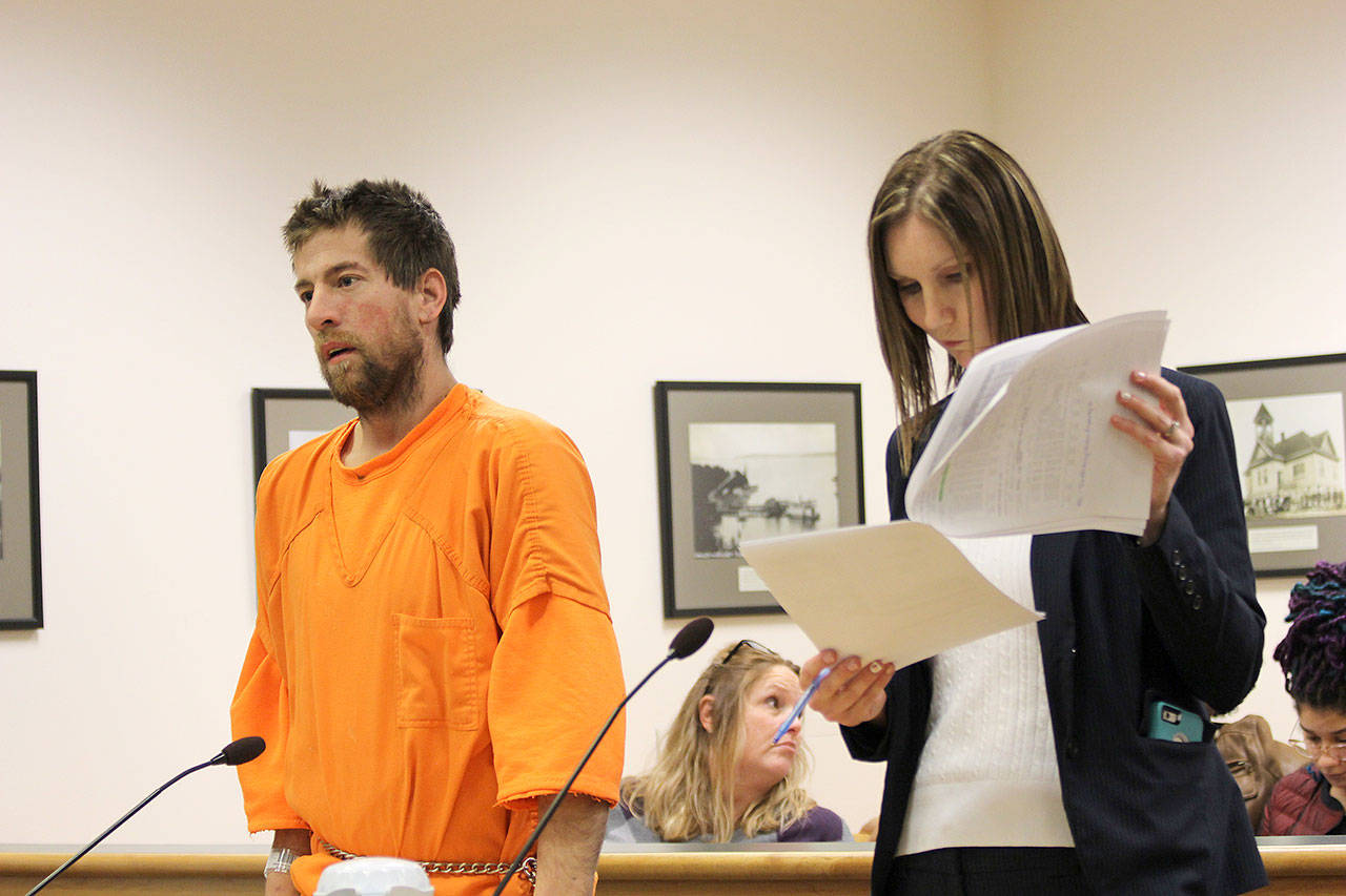 Jessie Stensland / Whidbey News Group                                John Bagley, left, makes a preliminary appearance in Island County Superior Court Monday. He’s accused of pawning a telescope stolen from a robotics club.