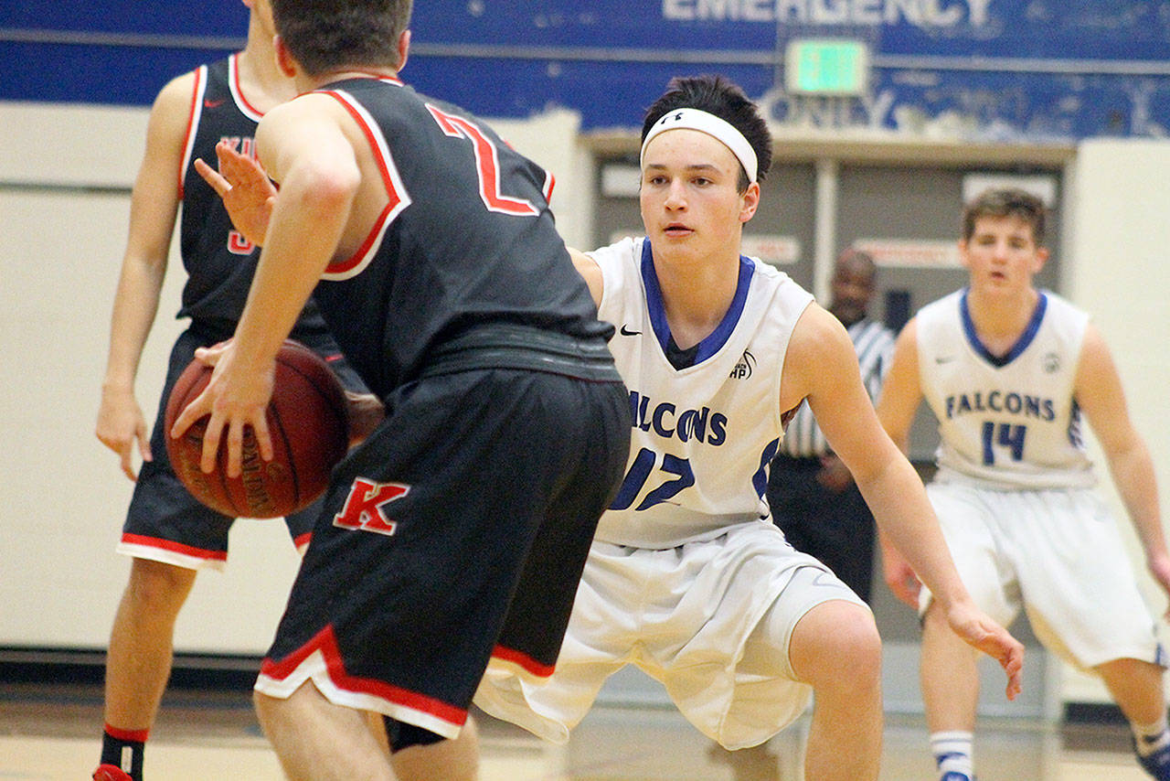 Evan Thompson / The Record — South Whidbey sophomore Dexter Jokinen defends against King’s junior Hunter Reeves during the Falcons’ 62-41 loss in the 1A District 1 tournament on Feb. 9 at Erikson Gymnasium.