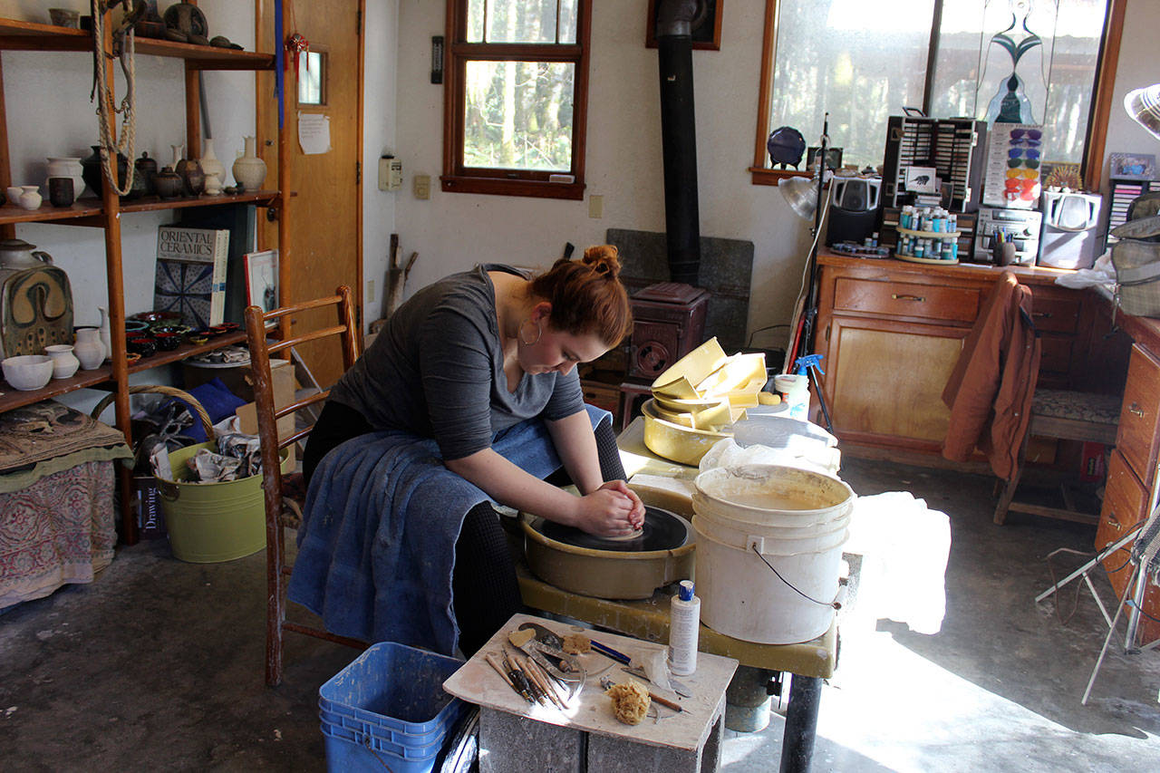 Waldorf student Megan Fickel chose to learn about clay art for her 8th-grade project from mentor Joan Govedare. Focus and concentration are required to throw pots but it also felt meditative, Fickel said. She dreams of one day having her own studio and perhaps teaching art to children. Photo by Patricia Guthrie/Whidbey News-Group