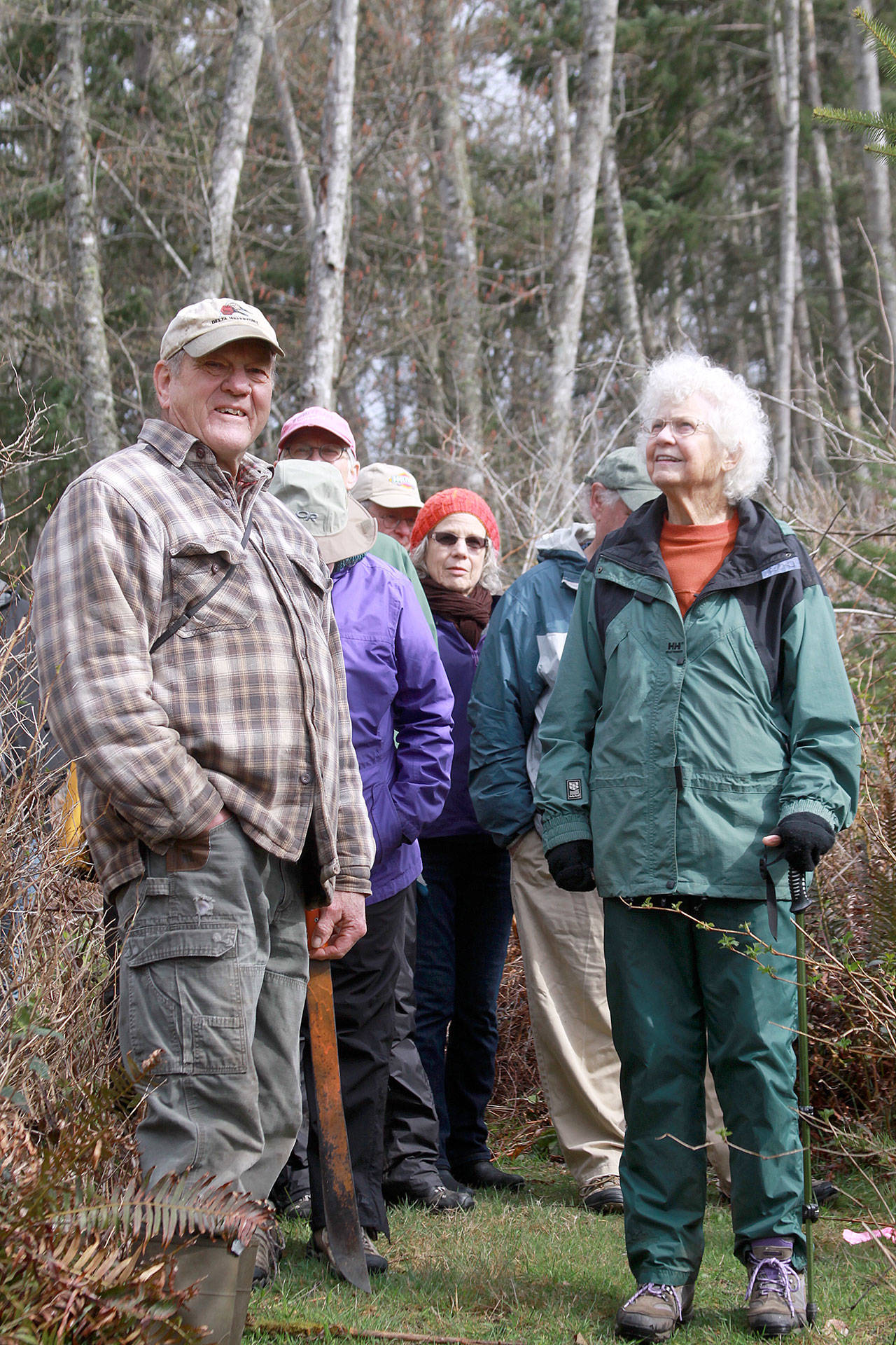 Ron Newberry photo                                Gillian Beattie of Langley, right, soaks in the scenery while standing next to Sievert Rohwer, left, during a tour of Rohwer’s property near Clinton on April 7.