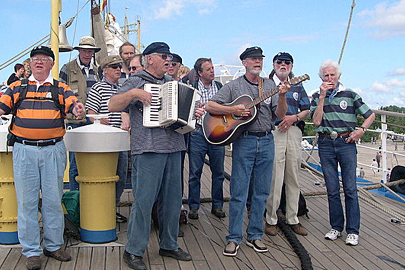 Photo provided                                The Shifty Sailors play at the Tall Ship Festival in Riga, Latvia in 2003 aboard the German sailing vessel Seute Deern. Pictured are Jim Amis, Mike Thelen, Wylie Vracin, Karl Olsen, Clarke Harvey, Vern Olsen (accordion), Ray Loe, Bruce Bardwell, Denny Armstrong (guitar), Jack Moeller and Peter Lawl.