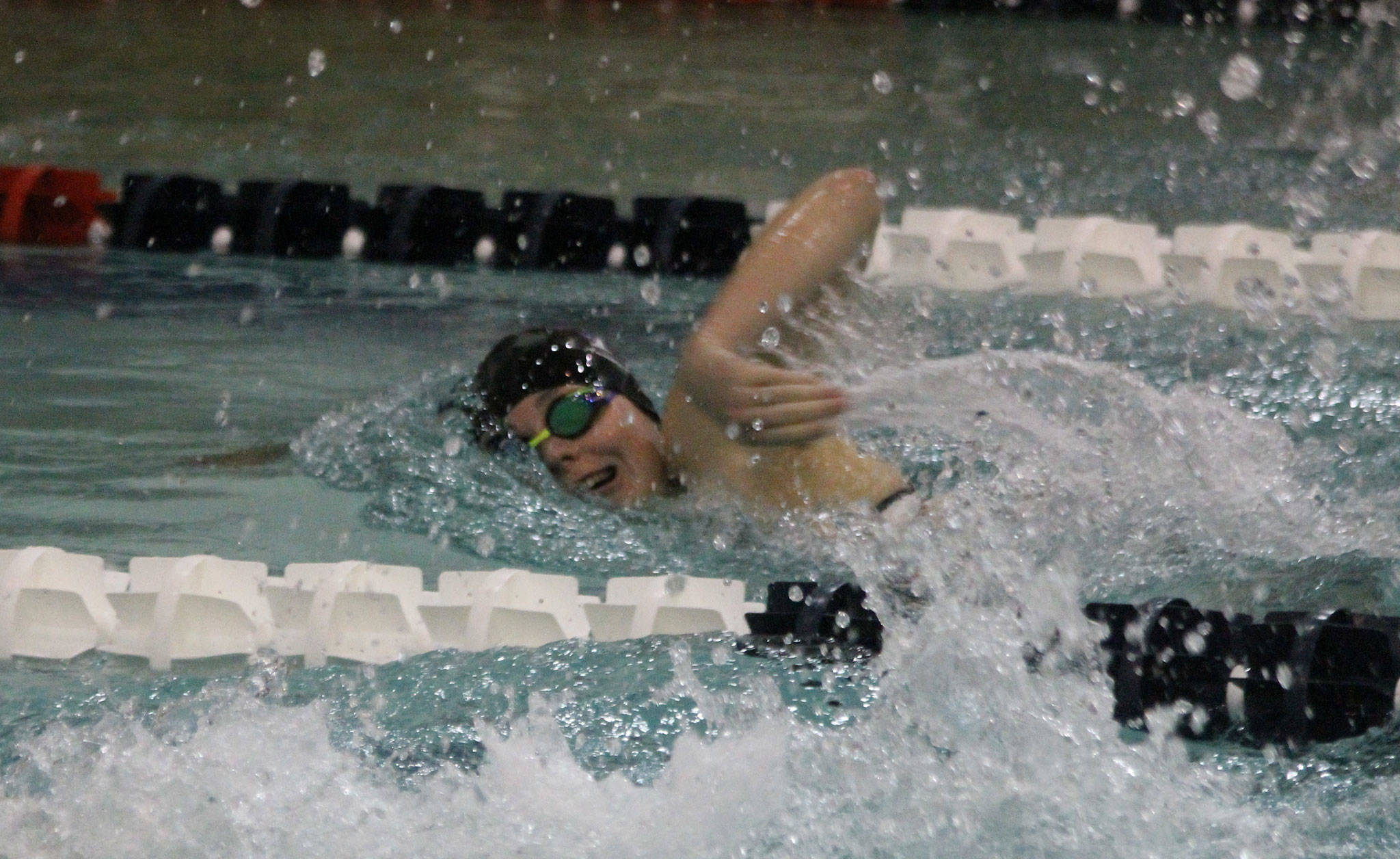 Ashley Lynch swims to fourth place in the 200 freestyle at the district meet Saturday. Her time earned the South Whidbey junior a berth in the state meet.(Photo by Jim Waller/South Whidbey Record)