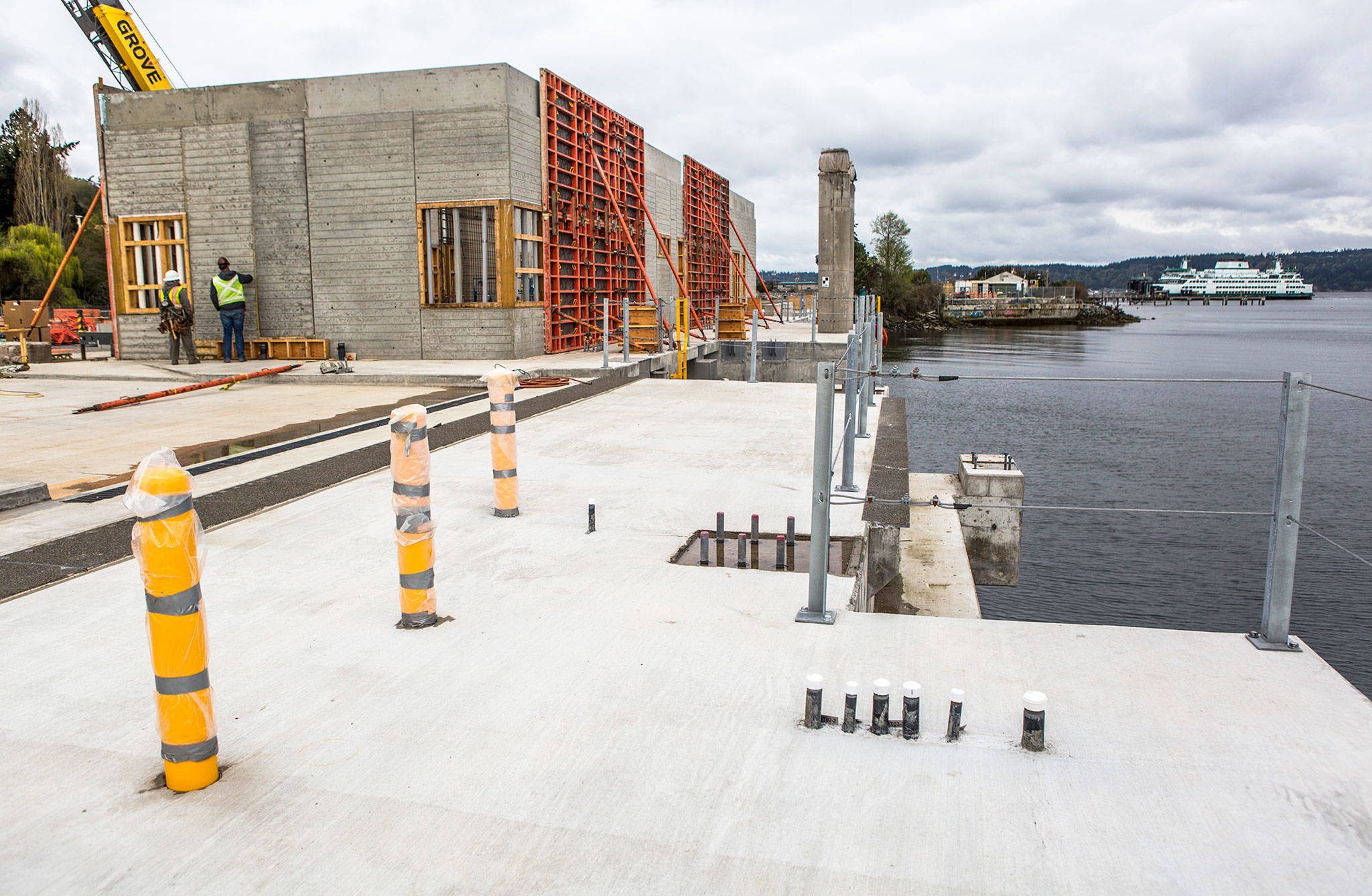 Olivia Vanni / The Herald                                A ferry pulls into the current Mukilteo Ferry Terminal as construction continues on at the site of the new Mukilteo ferry terminal on Wednesday.