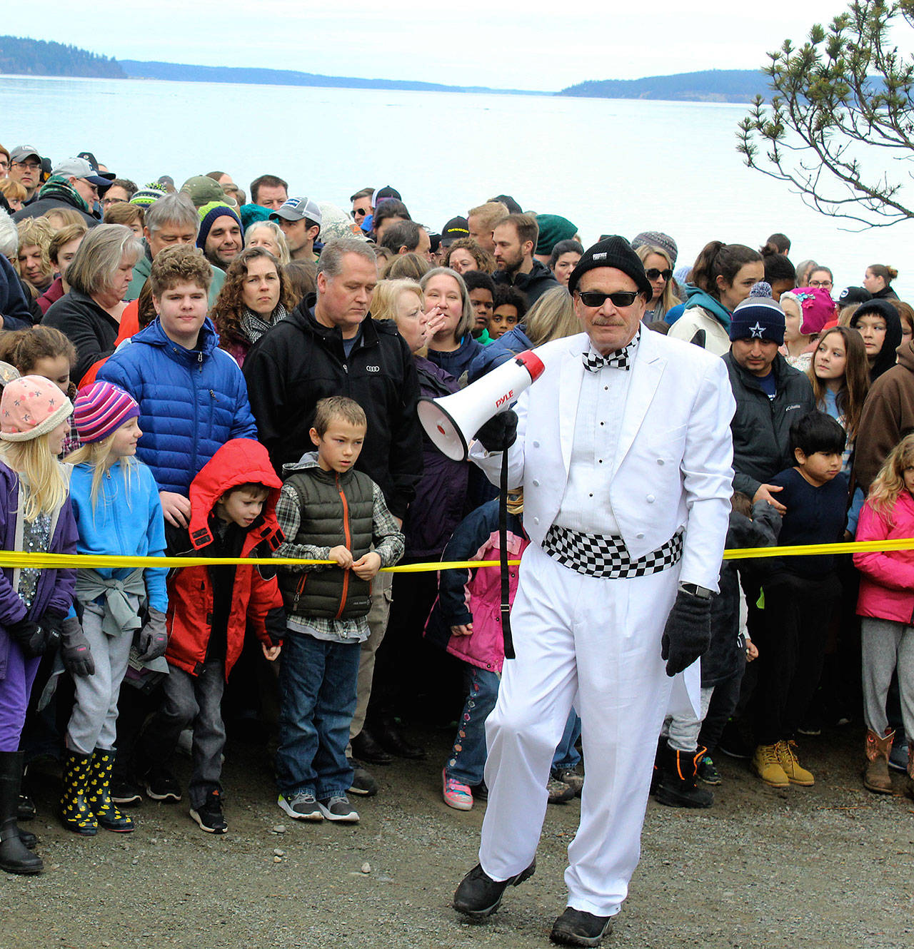 Langley Mayor Tim Callison said he plans to seek another term in November’s general election. For events, such as this year’s Sea Float Scramble, Callison always wears a white tuxedo with a changing collection of cummerbunds and accessories. (Photo by Patricia Guthrie/Whidbey News Group)