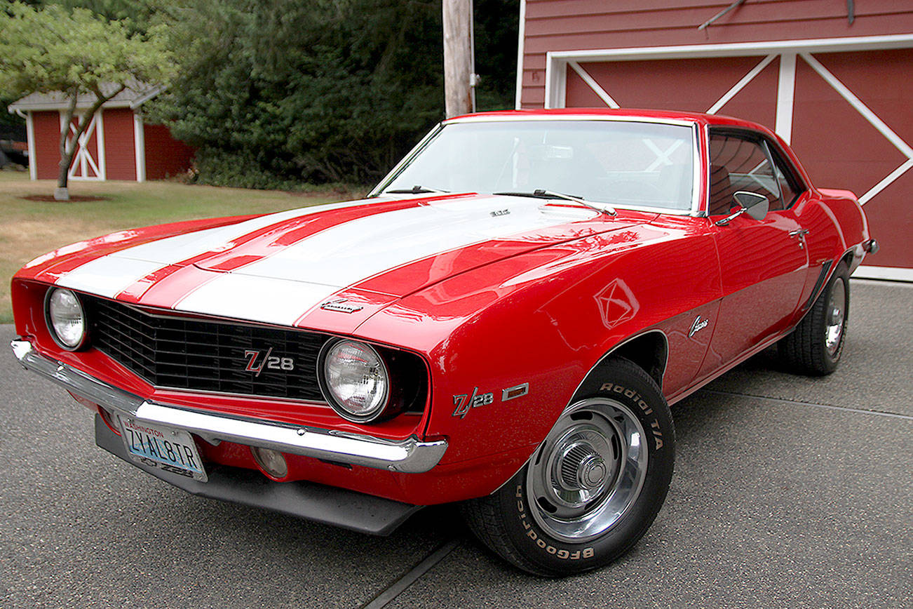 Ray Harding stands with 1969 Chevrolet Camaro Z/28, which will appear in the car show Sunday. (Photos by Laura Guido/South Whidbey Record)