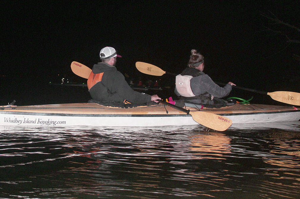 Kayakers glide from Langley Harbor on bioluminescent adventure in Saratoga Passage. Photo by Wendy Leigh/South Whidbey Record