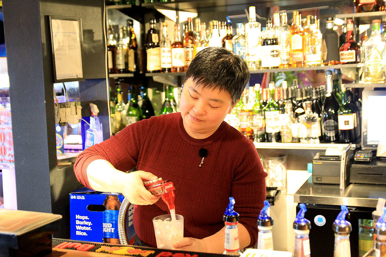 Photo by Kira Erickson/Whidbey News Group                                Owner Jennifer Hua mixes a drink for a patron.