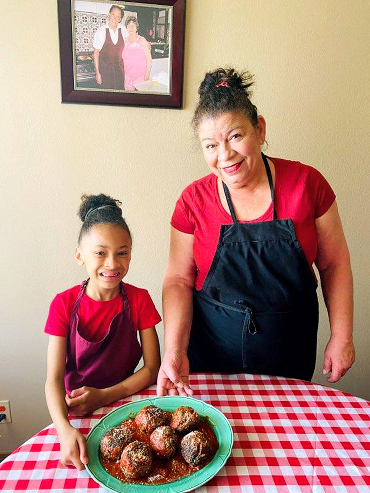 Photo provided                                “Auntie” Jackie Huerta often has her 8-year-old granddaughter, Naomi Jean, to help her in the kitchen.