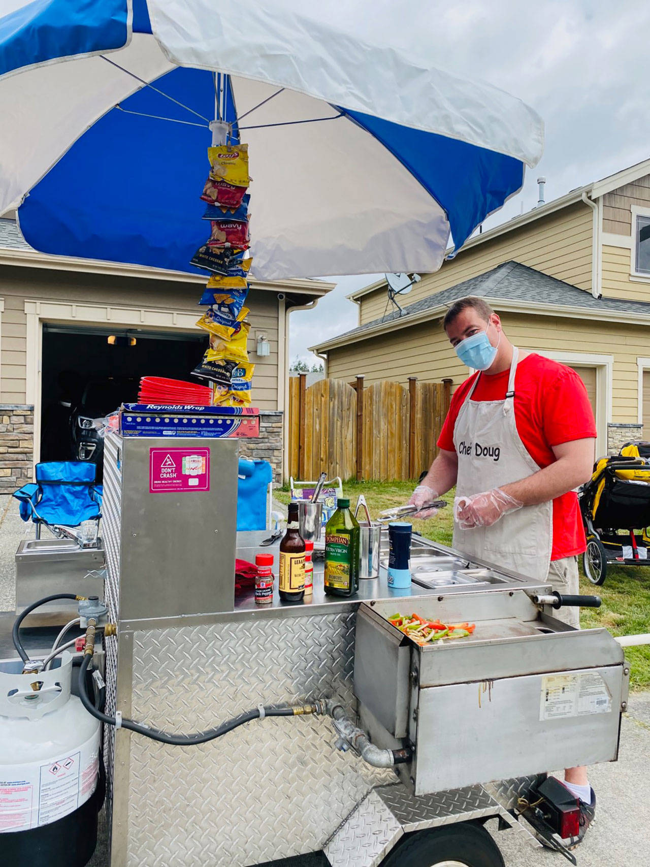 Doug Blynn cooks at the Flightline Franks hotdog stand. Photo provided