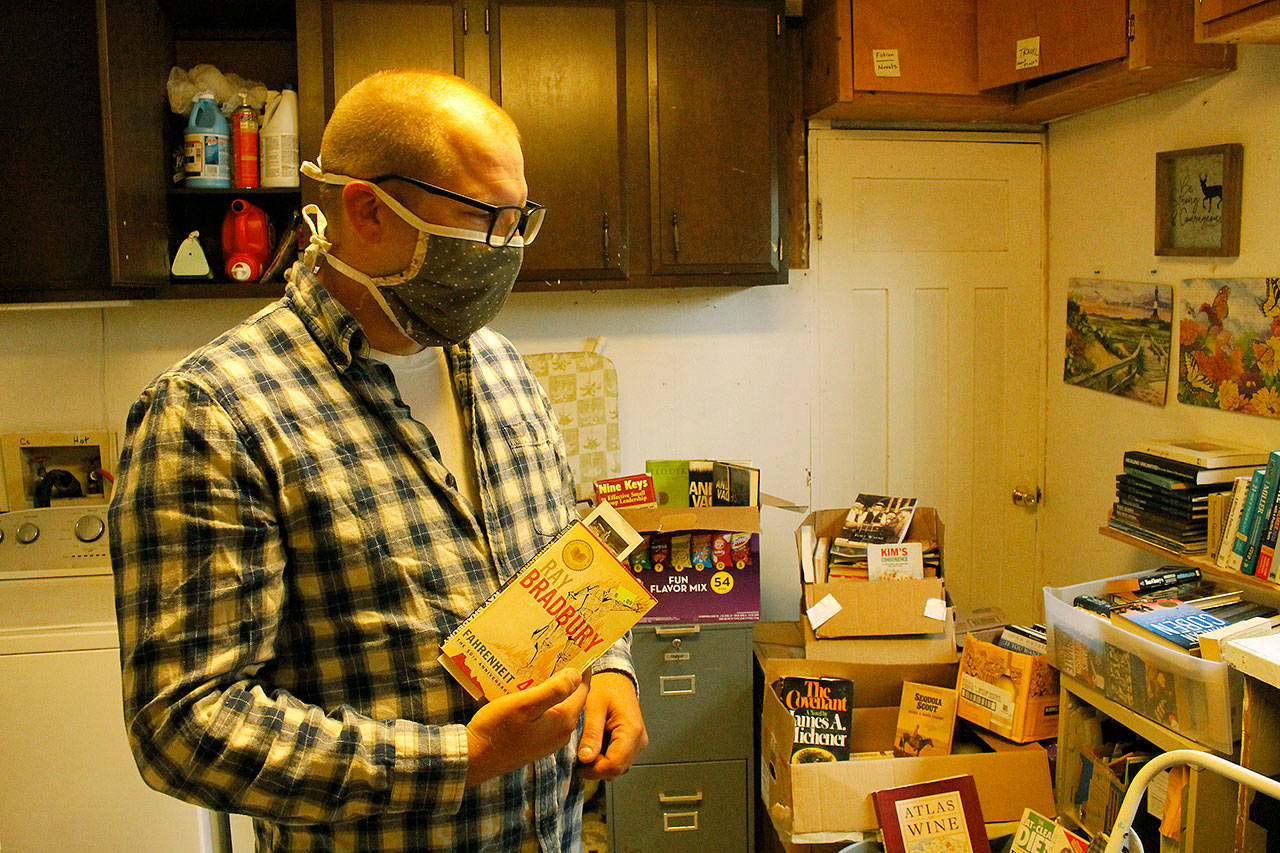 Photo by Kira Erickson/Whidbey News Group                                Kevin Tyler Lucas has collected 500 books within the last two weeks from donors, all of which he hopes will find new homes.