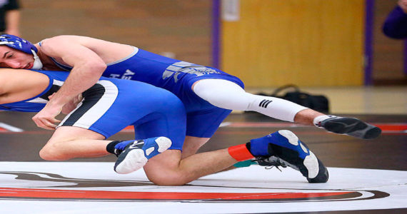 South Whidbey’s Drew Aposhyan, top, and the Falcon wrestling team hope to return to play Dec. 28. (Photo by John Fisken)