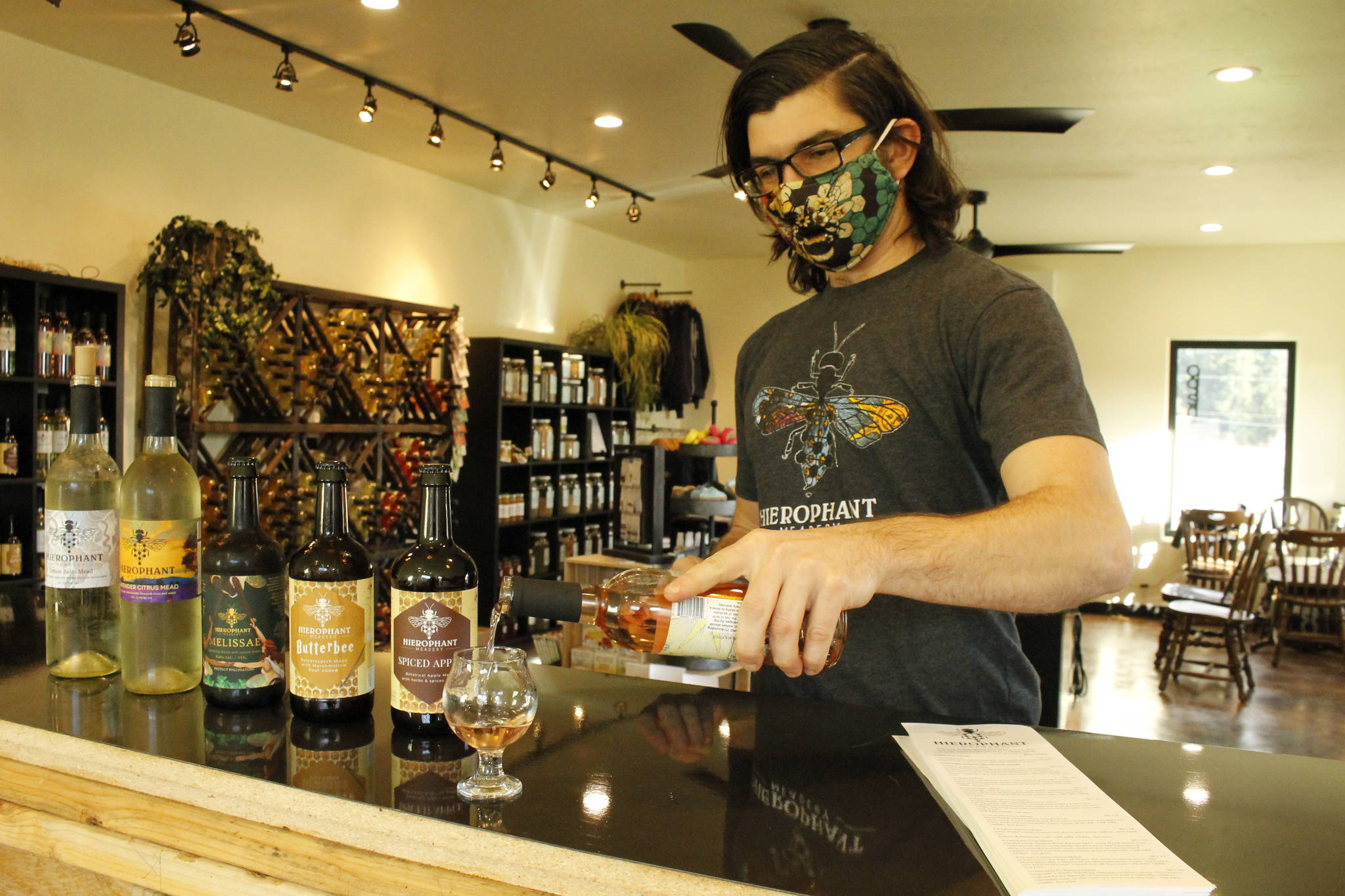 Mead maker Jeremy Kyncl pours a tasting glass of Hawthorn Tulsi Mead, a blend of hawthorn berry and holy basil, in the new Whidbey tasting room of Hierophant Meadery. Photo by Kira Erickson/South Whidbey Record