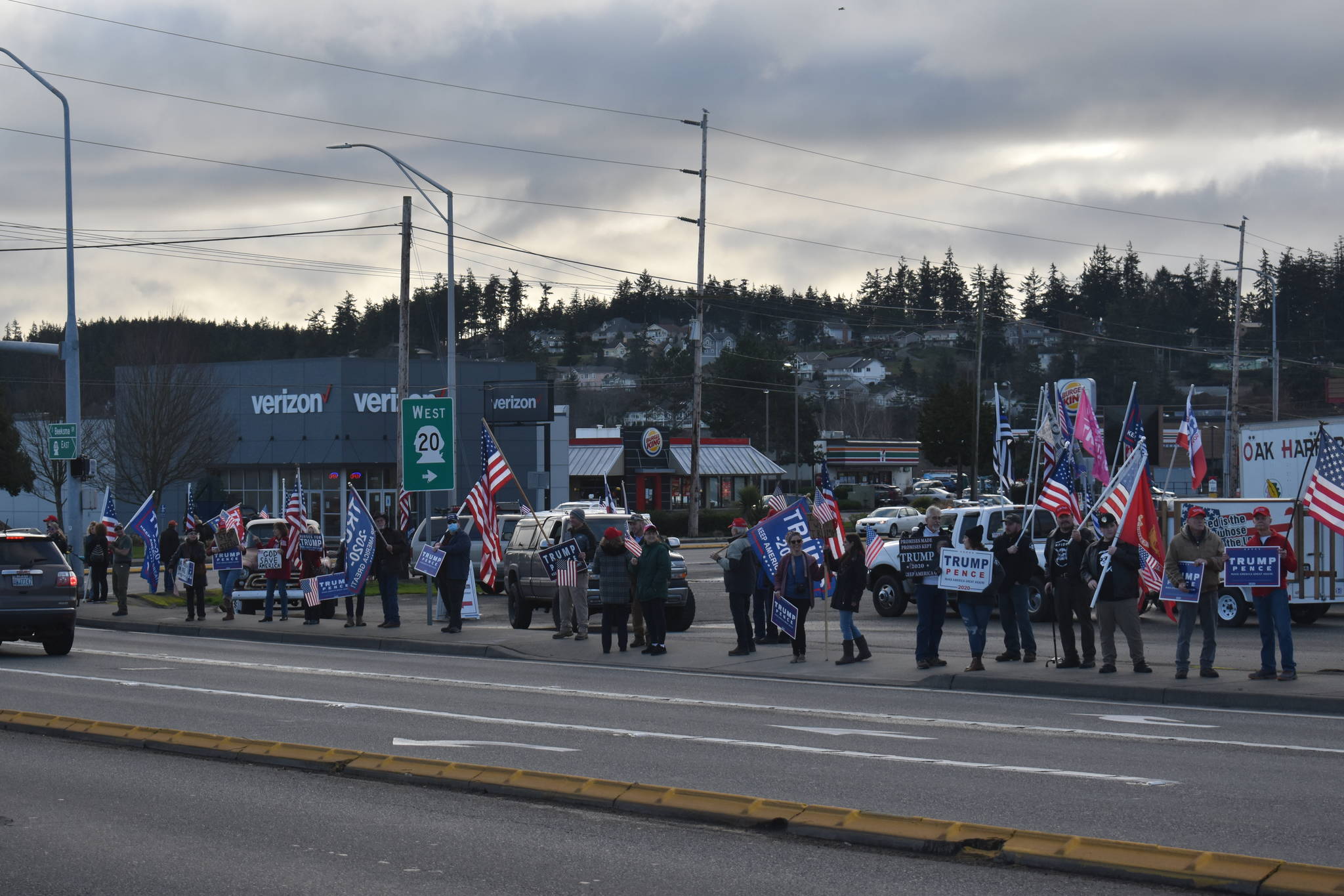 On Wednesday, Trump supporters gather at the intersection of Highway 20 and Southeast Pioneer Way in Oak Harbor to show their support for the outgoing president, and to protest the election of Joe Biden The event coincided with the storming of the U.S. Capitol by other President Donald Trump supporters. Photo by Emily Gilbert/Whidbey News-Times