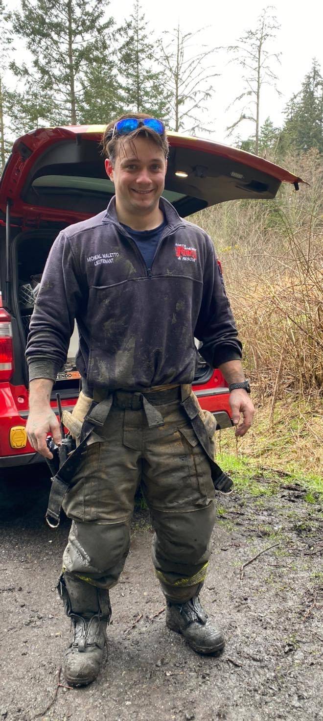 North Whidbey Fire and Rescue Lt. Micheal Maletto helped rescuers and the girl return to dry land after she was freed from the mud on Sunday at Dugualla State Park. Photo by Lolly Laura Titherington