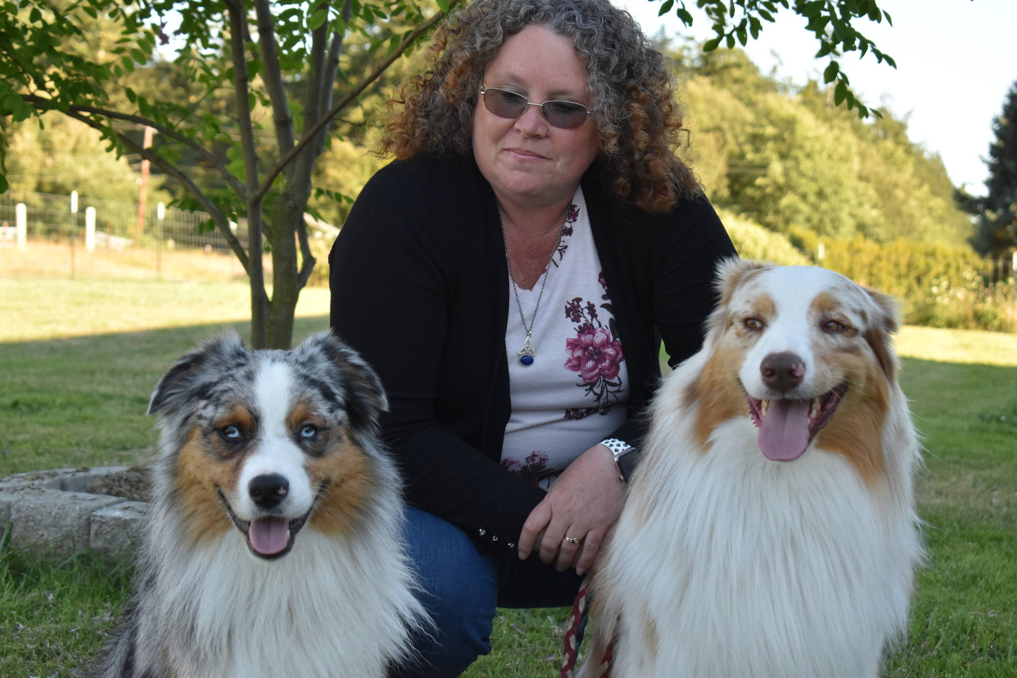 Photo by Emily Gilbert/Whidbey News-Times 
Tracy Dietz with her two Australian shepherds, Sirius, left, and Zoran.