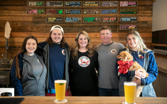 From left, Rachael Carrigan, Nate Hanson, Erin Hanson, Jeff Hanson and Kacie Hanson pose for a group photo at Thirsty Crab Brewing in Clinton. (Ryan Berry / The Herald)