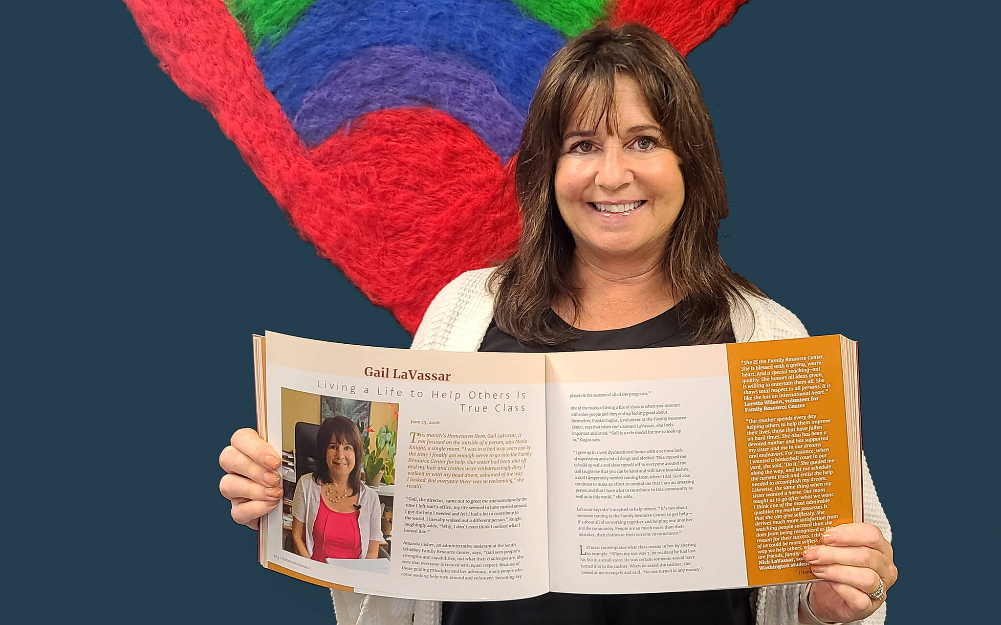 Photo provided
Gail LaVassar holds the new volume of Hometown Heroes open to her profile.