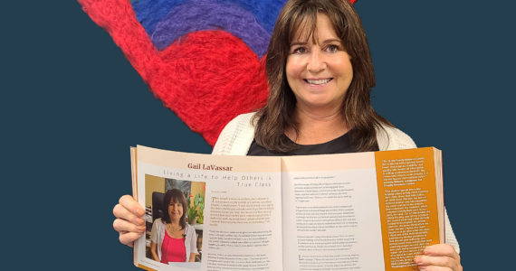 Photo provided
Gail LaVassar holds the new volume of Hometown Heroes open to her profile.