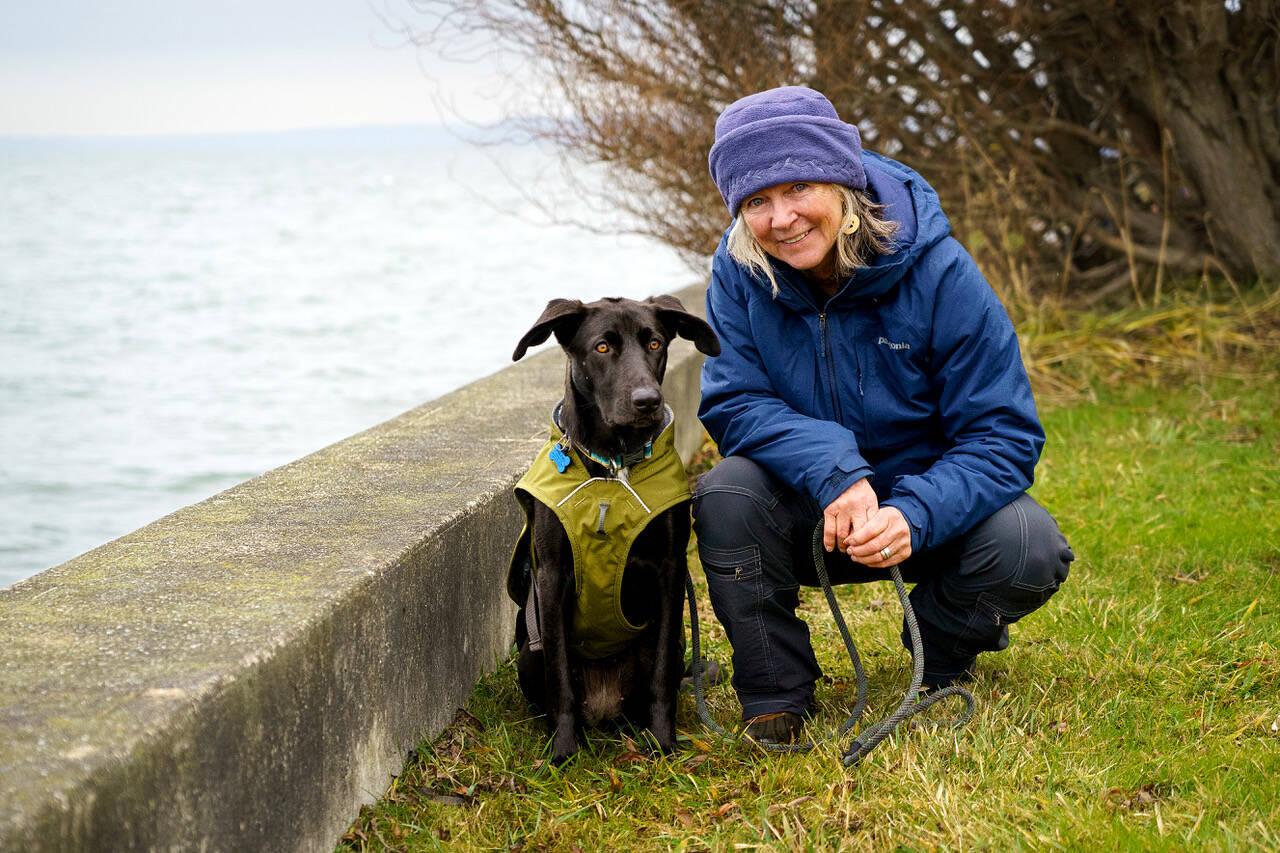 Elizabeth Johnson with rescue dog Pretzel. Her upcoming library talk focuses on understanding your own furry, four-legged friend better. (Photo by David Welton)