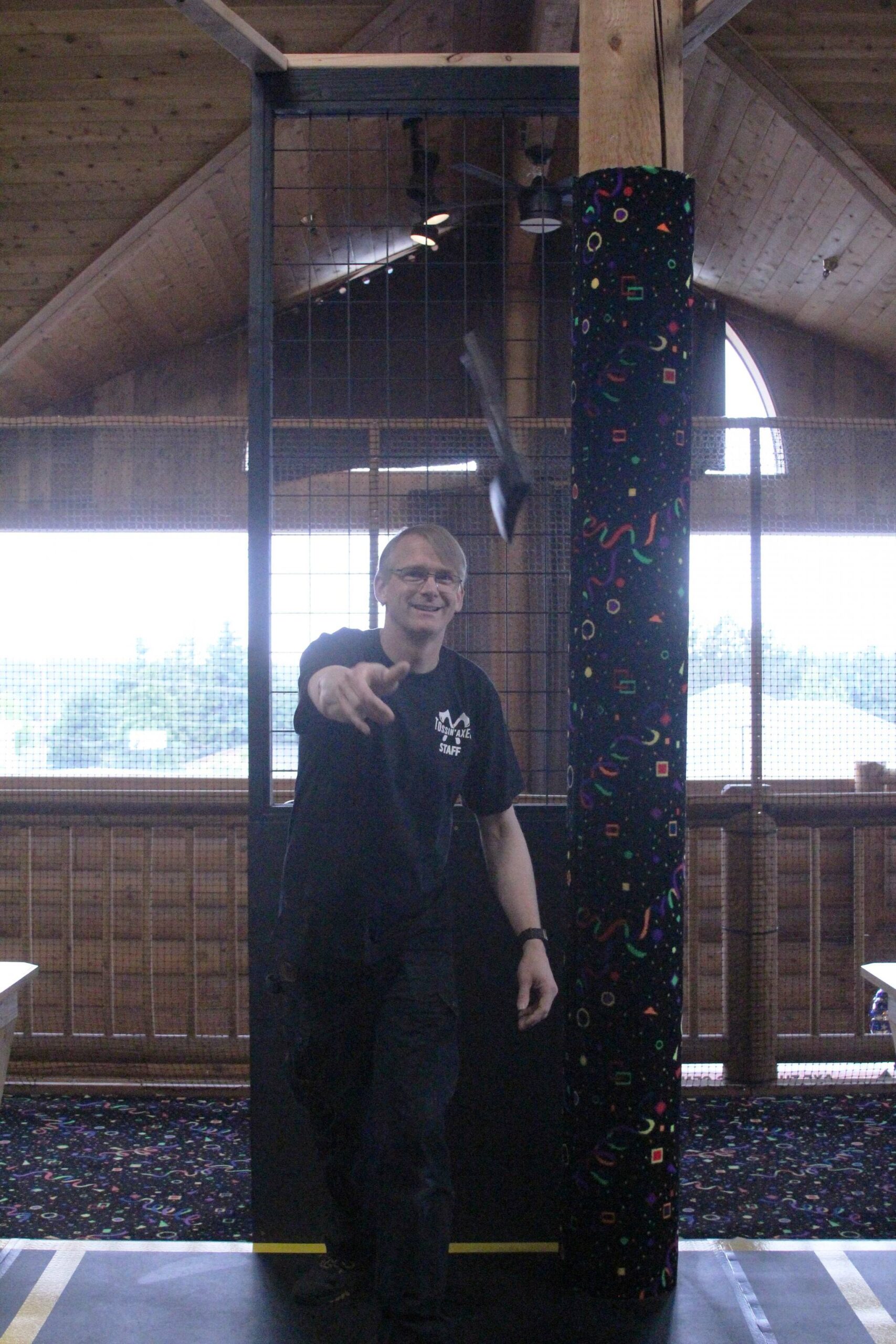 James Croft throws an axe at his new Oak Harbor entertainment business, Tossin’ Axes. (Photo by Karina Andrew/Whidbey News-Times)