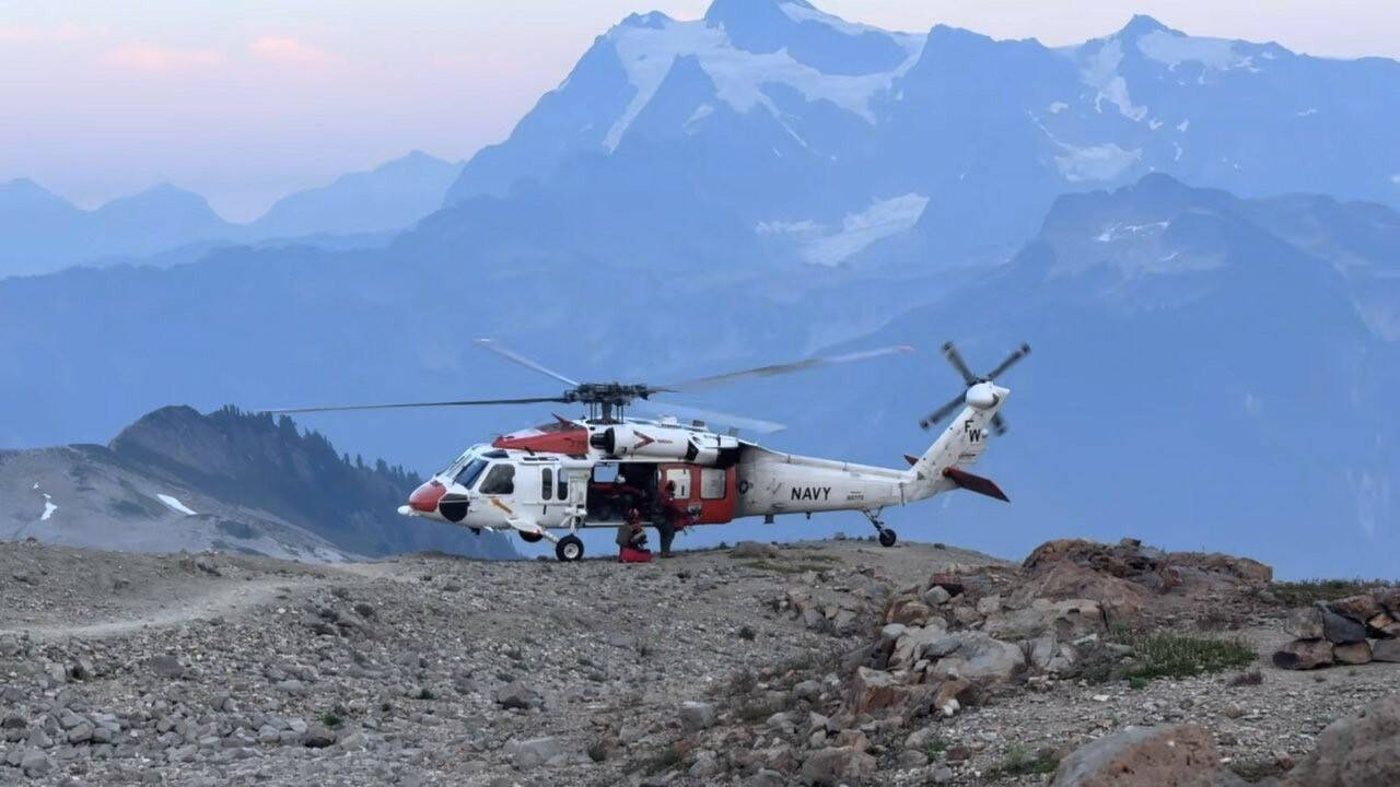 Official Navy Photo
NAS Whidbey Island’s SAR crewmen depart the aircraft on their way to prepare an injured hiker for transport to St. Joseph’s Hospital in Bellingham.