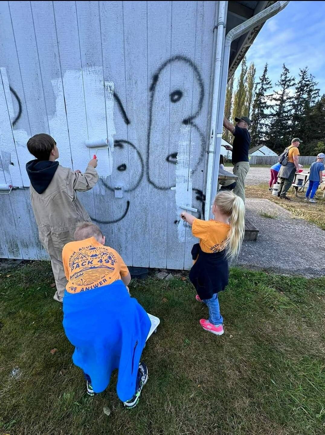 Some young scouts paint over graffiti at Volunteer Park. (Photo provided)