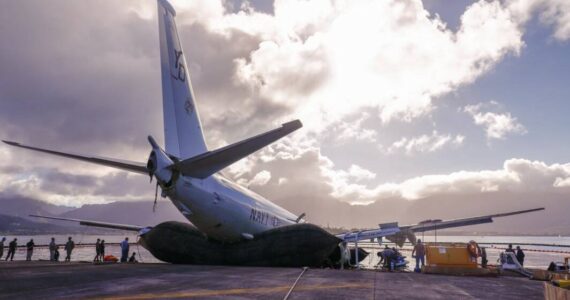 Photo by Lance Cpl. Hunter Jones
The Navy P8-A Poseidon is removed from the water with the help of inflatable salvage roller bags, placed under the aircraft.