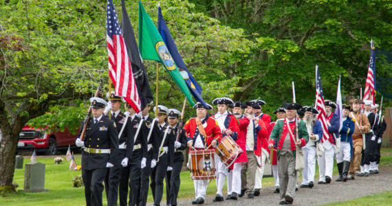 CPO William Thiel, US Navy (Ret) Oak Harbor High School NJROTC Color Guard, Joined by Sones of the American Revolution, George Washington Chapter and USN Sea Cadets Corps, ORION Squadron present the colors at the Memorial Day Service of Remembrance at the Maple Leaf Cemetary, May 27 (photo by Caitlyn Andrson)