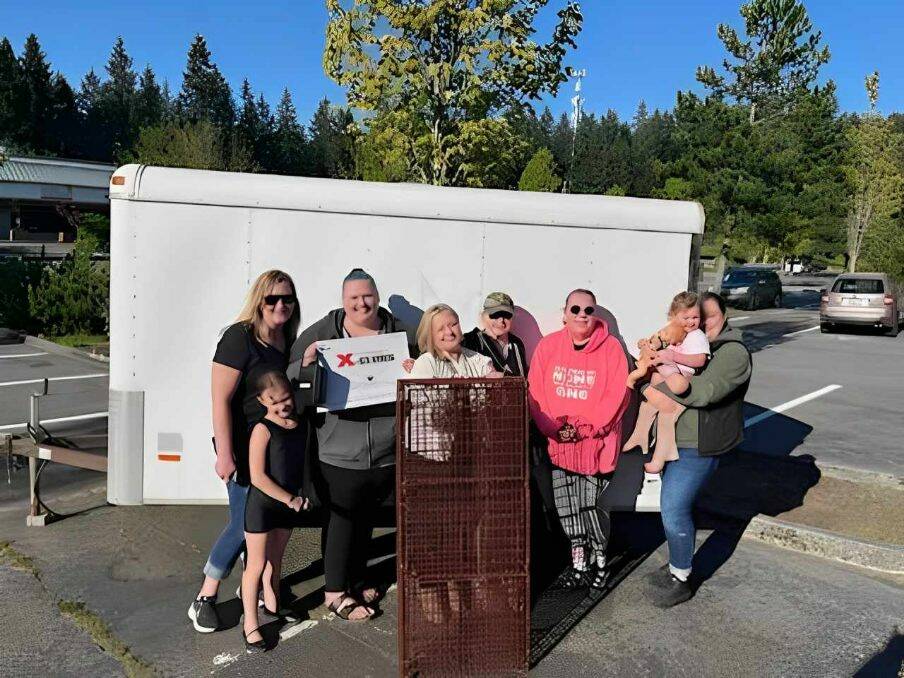 Photo provided
Animal rescue volunteers Summer Bowlin, Jackie Lasater and others pose with a new trap and drone as provided by community support.