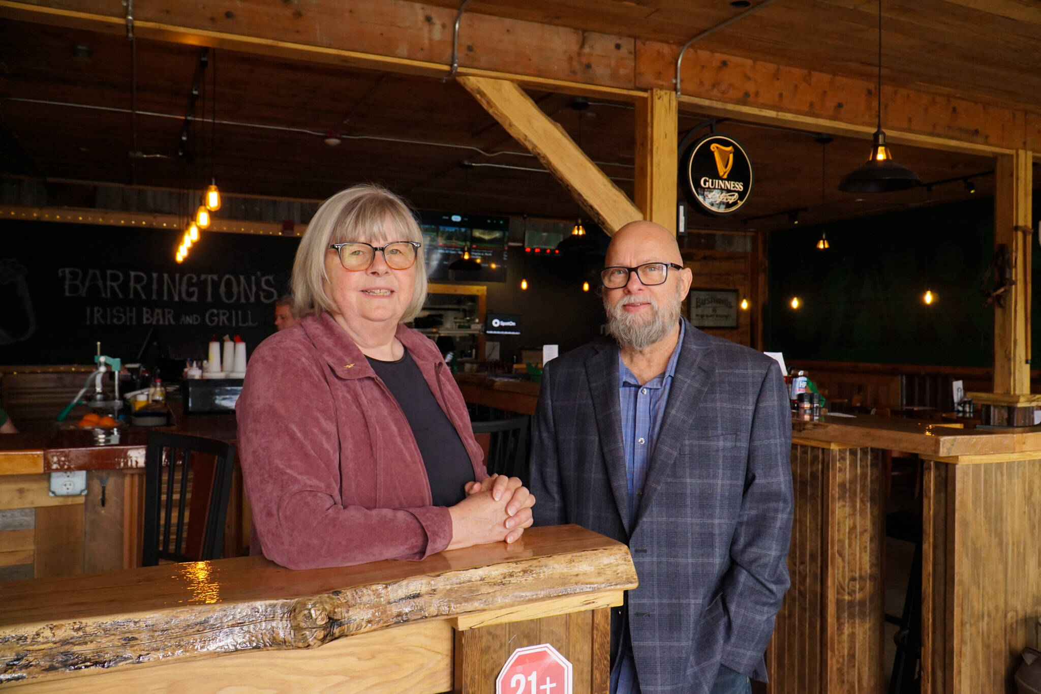 Mercedes Fulwiler, left, and Jason Tritt, co-owners of Barrington’s Irish Bar & Grill on Pioneer Way, pose before their grand opening. (Photo by Sam Fletcher)