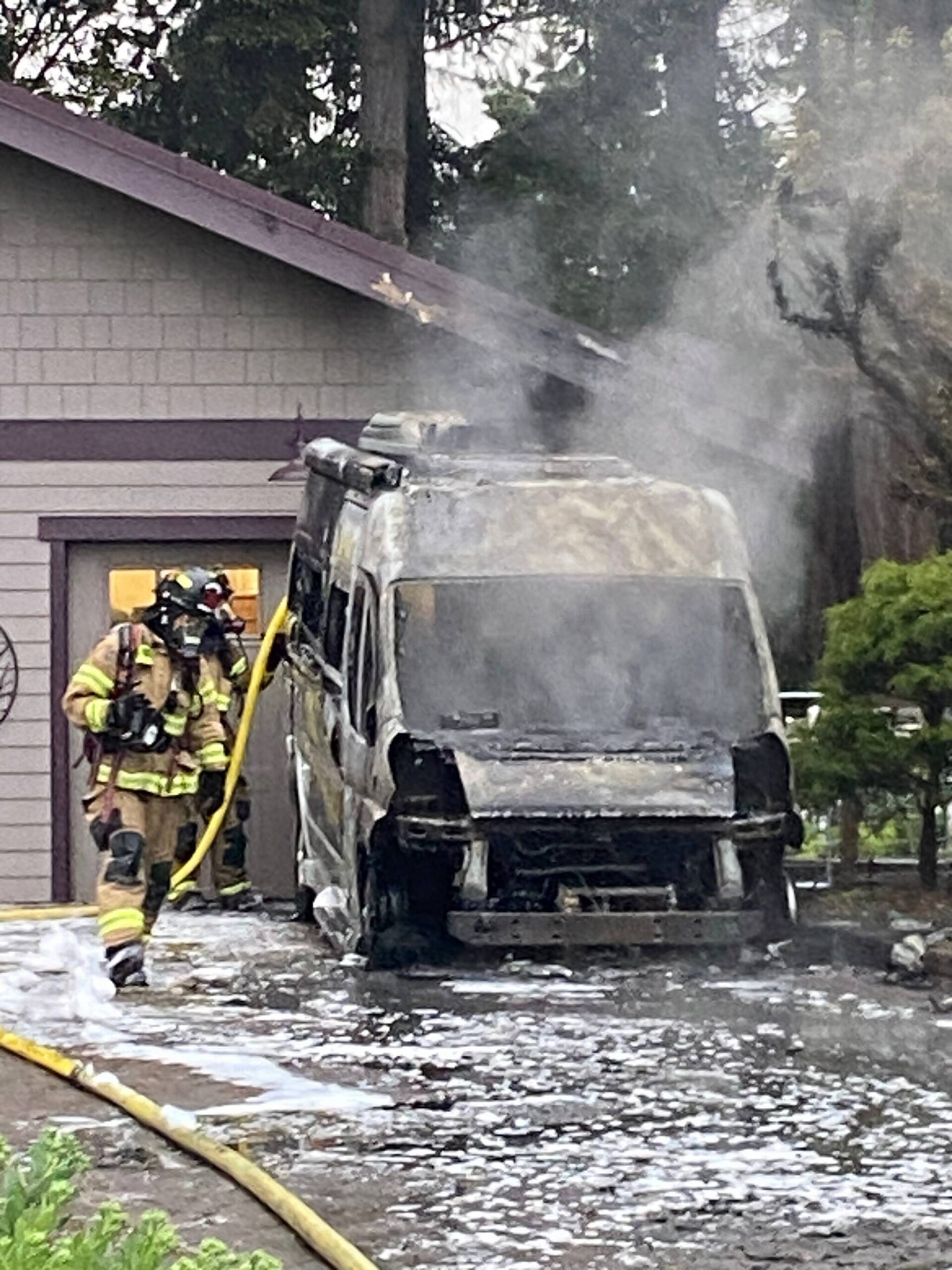 Photo provided by South Whidbey Fire/EMS
Firefighters successfully contained a blaze that originated in an RV from spreading to the nearby home.