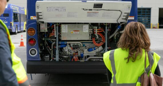 The hydrogen-powered guts of a new zero-emission Community Transit bus are seen under an open hood at the Community Transit Operations Base in Everett. (Ryan Berry / The Herald)