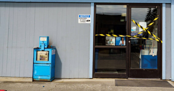 Police tape covered the door to the Clinton Post Office Wednesday. (Photo by David Welton)