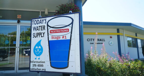 Oak Harbor’s Water Supply signs recently dropped to Stage 1, recommending water conservation practices. (Photo by Sam Fletcher)