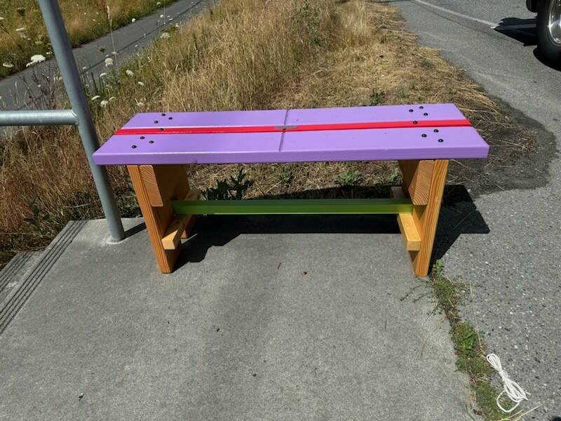 A purple and red bench sits at one of the Island Transit bus stops on South Whidbey. (Photo provided)