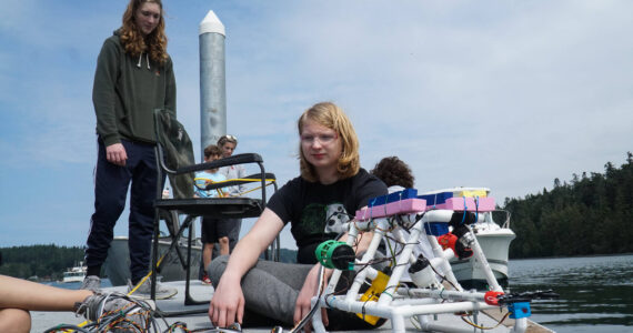 Photo by Sam Fletcher
Brenden Vandervort sits with a robot he built at Cornet Bay on Friday.