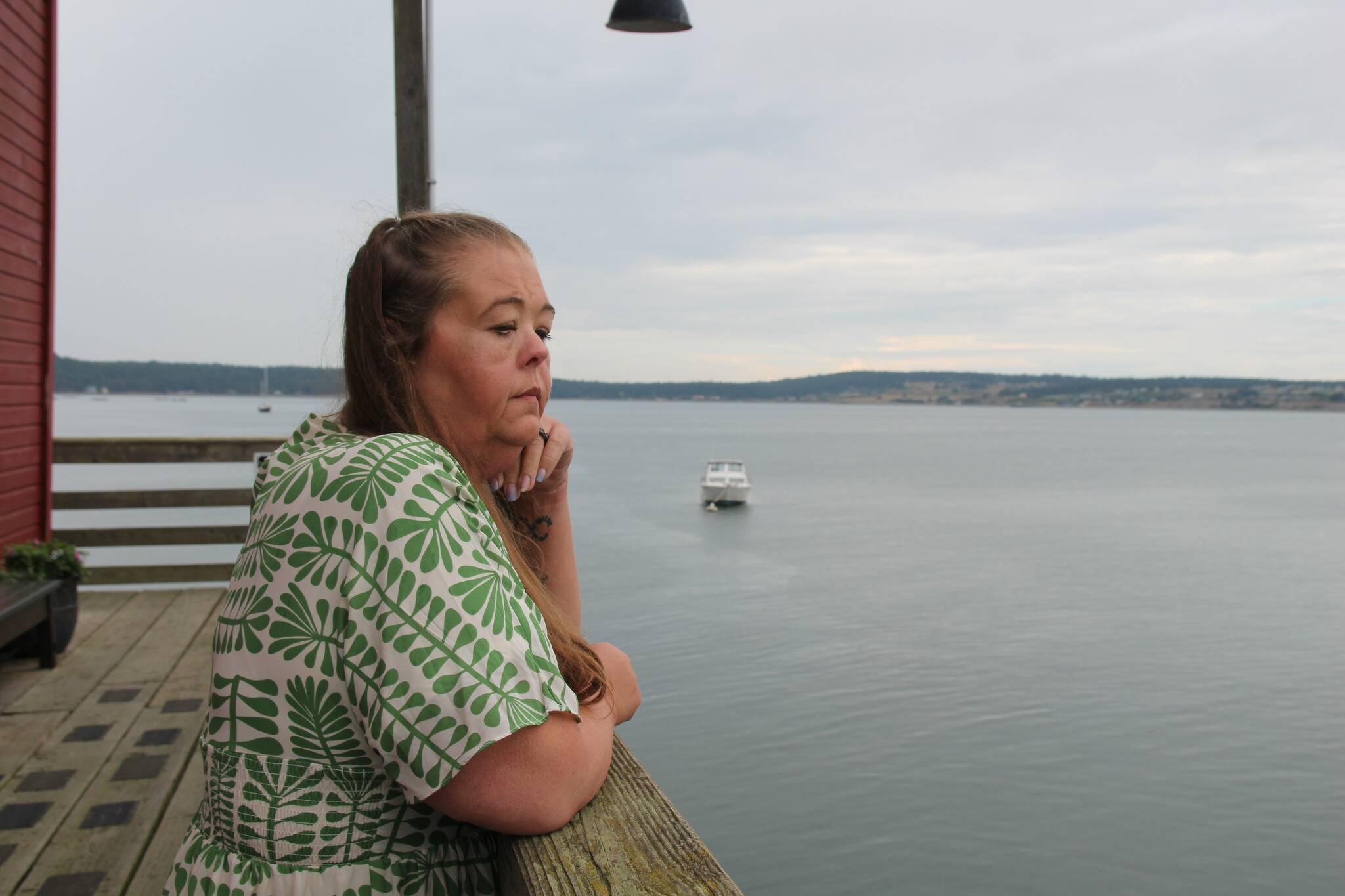 Photo by Luisa Loi
Death Doula Amy Briscoe pensively admires the waters of Penn Cove from the Coupeville Wharf.