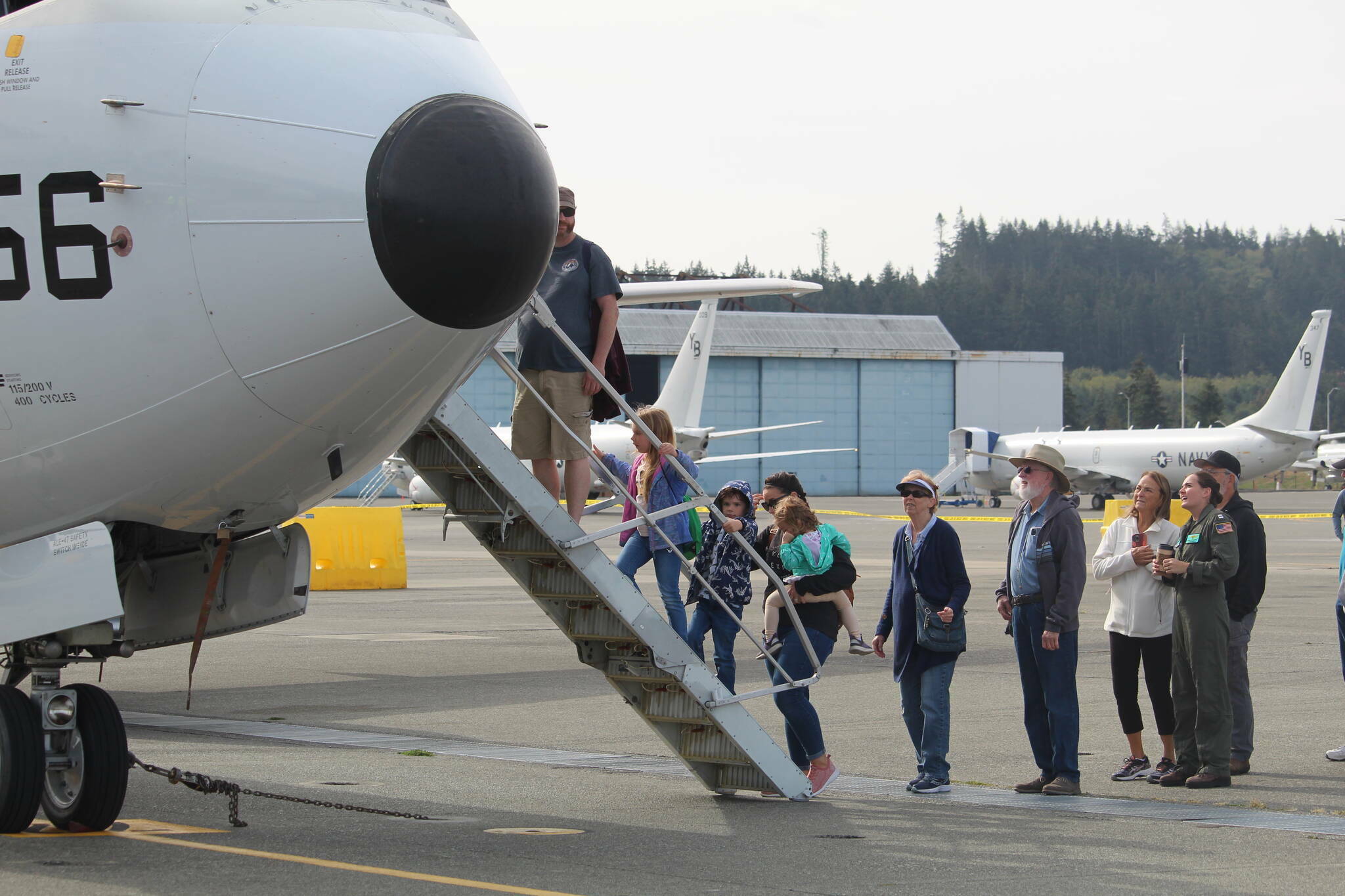 Photo by Karina Andrew
Guests tour the flightline at Naval Air Station Whidbey Island at a previous open house.