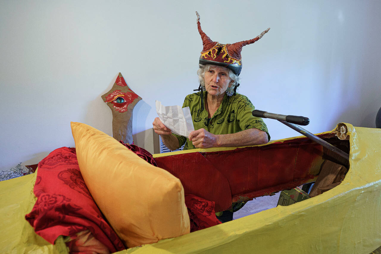 Gretchen Lawlor reads a poem about the Soup Box Derby by her father, Peter Lawlor, that she found tucked inside her racecar from 2019. (Photo by David Welton)