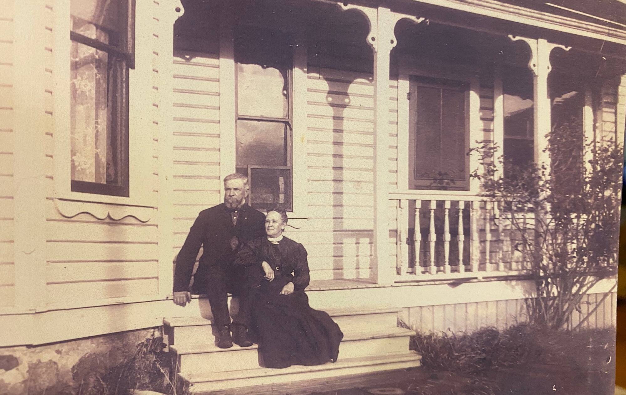 Francis and Mary Ellen LeSourd sit on the porch of the home they built in 1892. (Photo provided)