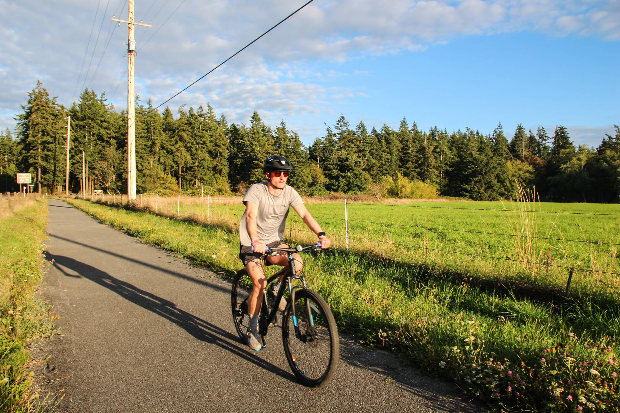 Photo by Luisa Loi
Oak Harbor resident Patrick Hanlon rides a bike on the Rhododendron Trail near Coupeville.