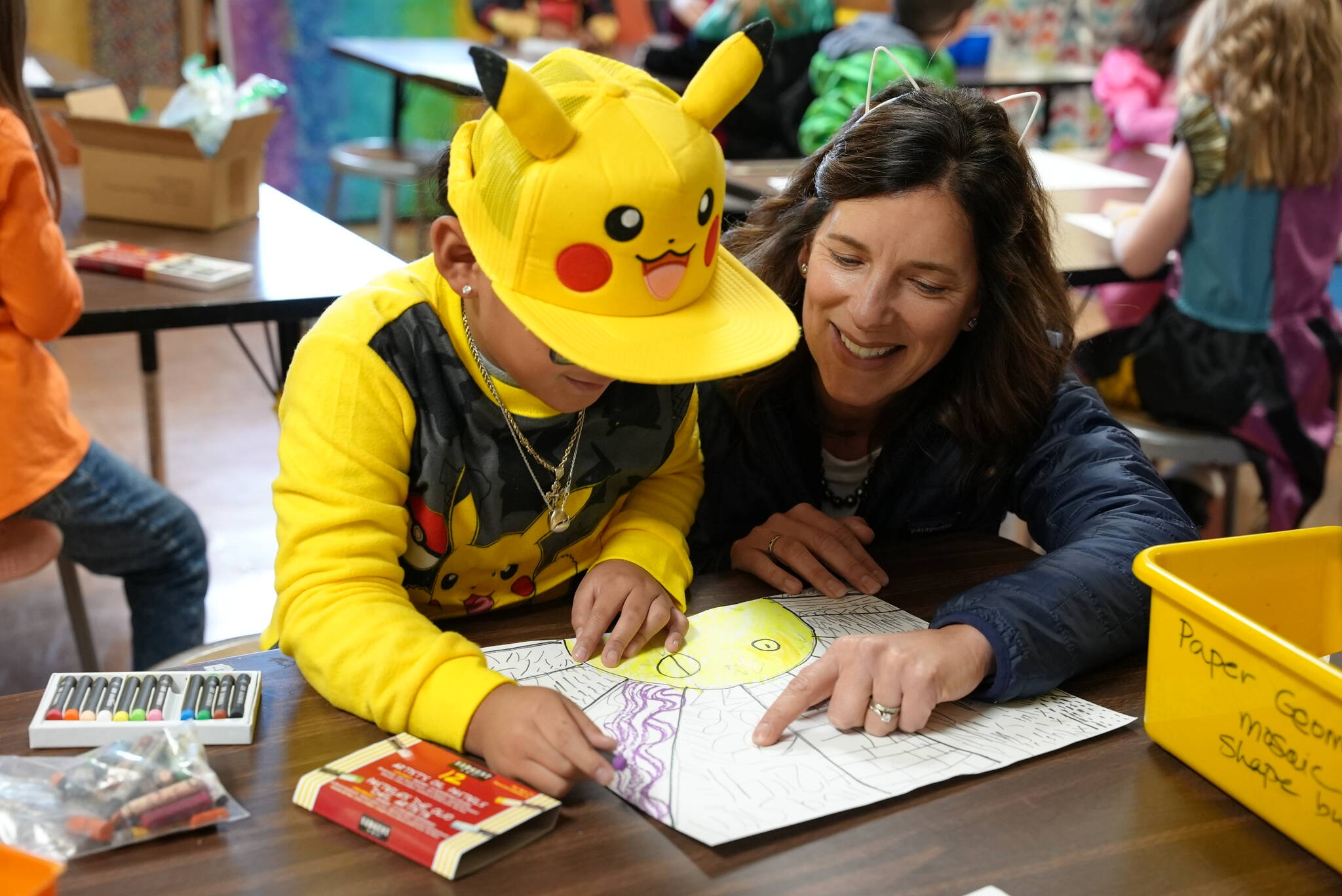 Superintendent Michelle Kuss-Cybula helps a student.