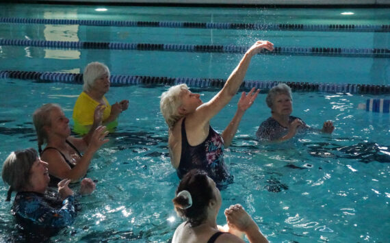 Carol Parbs hits the volleyball at the John Vanderzicht Memorial Pool Monday morning. (Photo by Sam Fletcher)