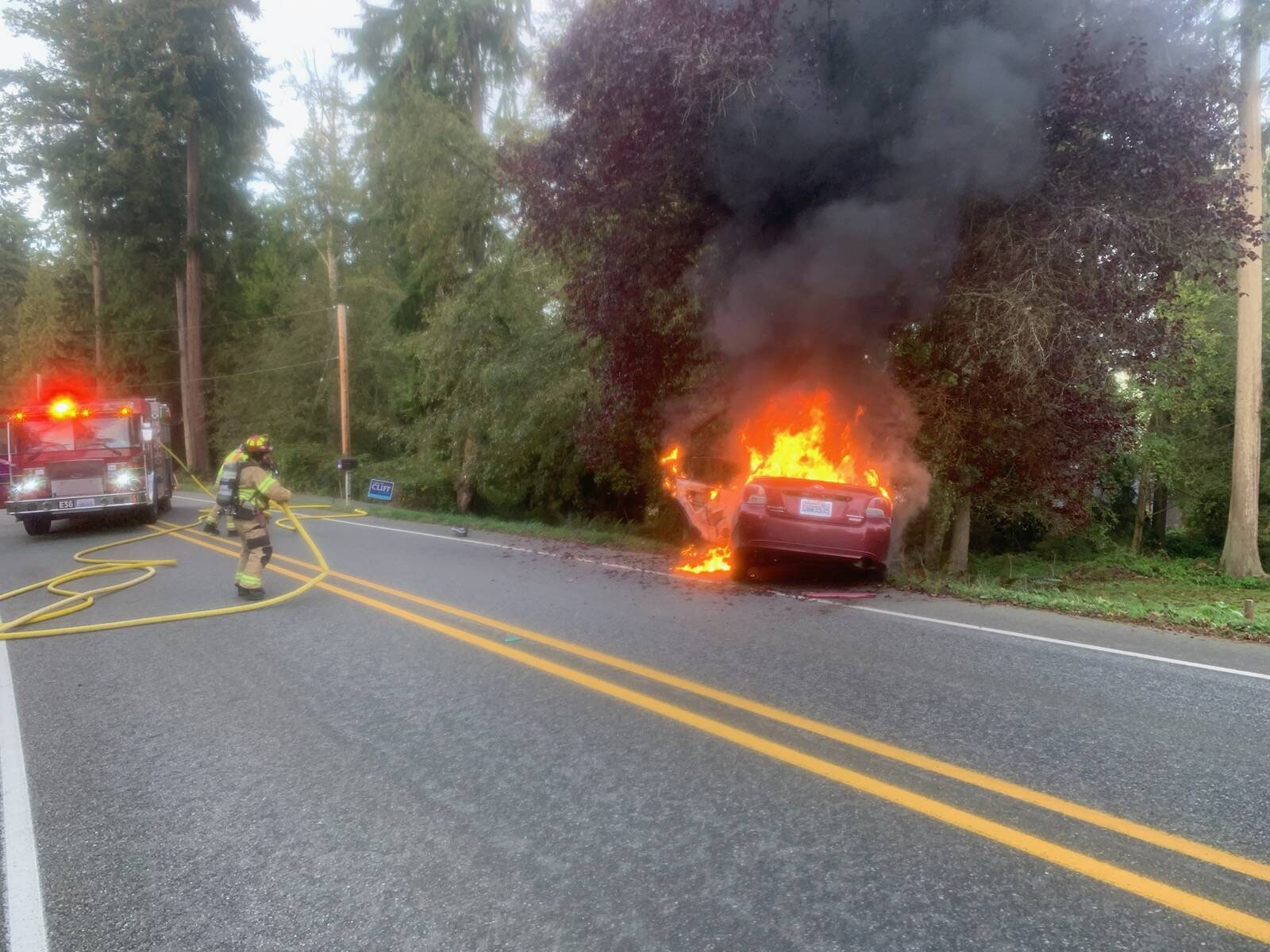 (Photo provided by South Whidbey Fire/EMS)
A car caught on fire Thursday morning in Freeland when it struck a tree.